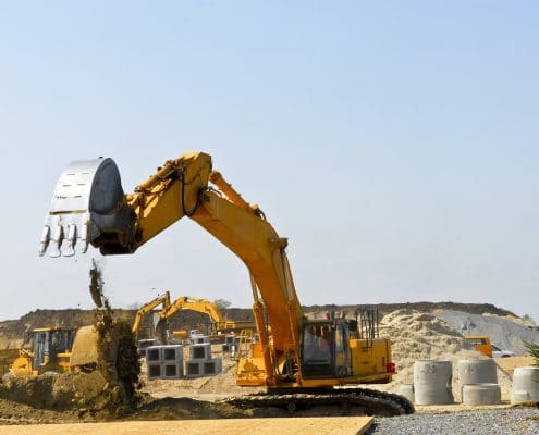 Yellow bulldozer machines digging